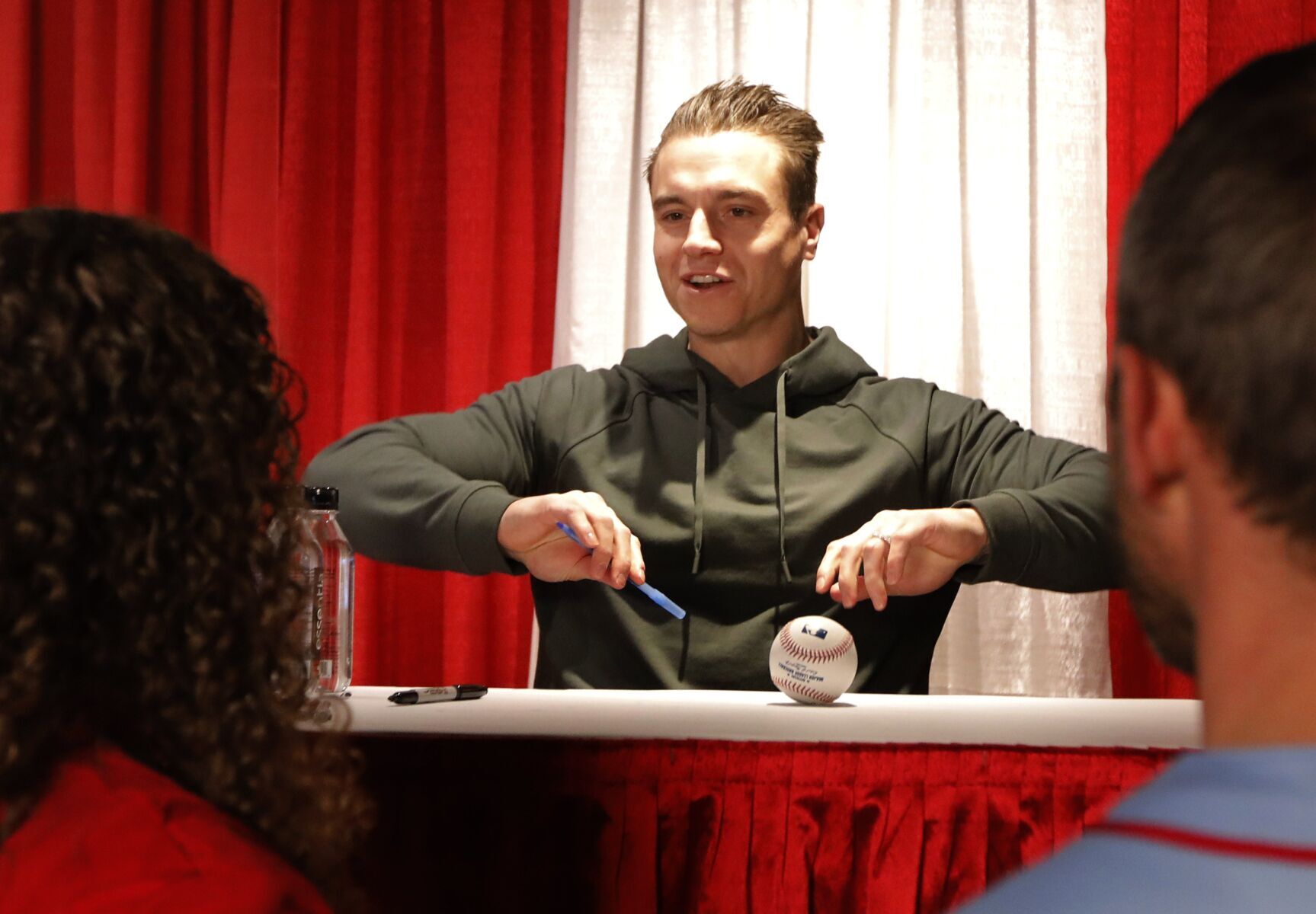 St. Louis Cardinal left fielder Tyler O'Neill signs autographs